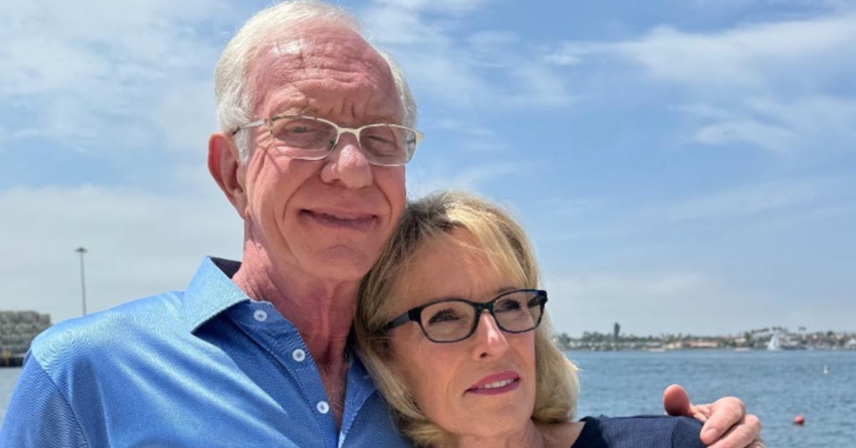 Captain Sully and his wife by the water.