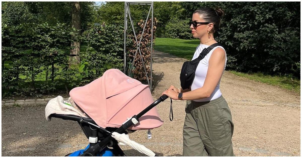 Annie Samples pushing a stroller in Copenhagen