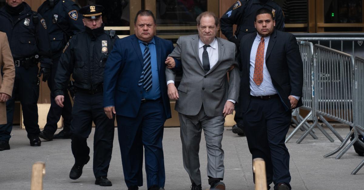 Harvey Weinstein walking with assistance