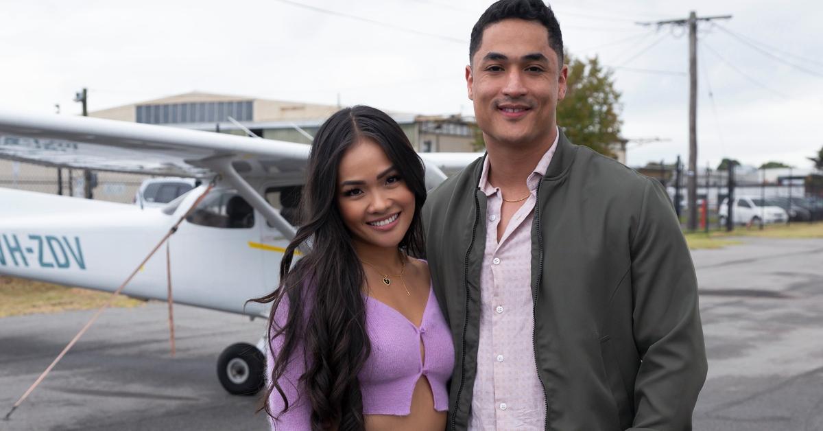 Jenn and Marcus stand in front of a plane on The Bachelorette