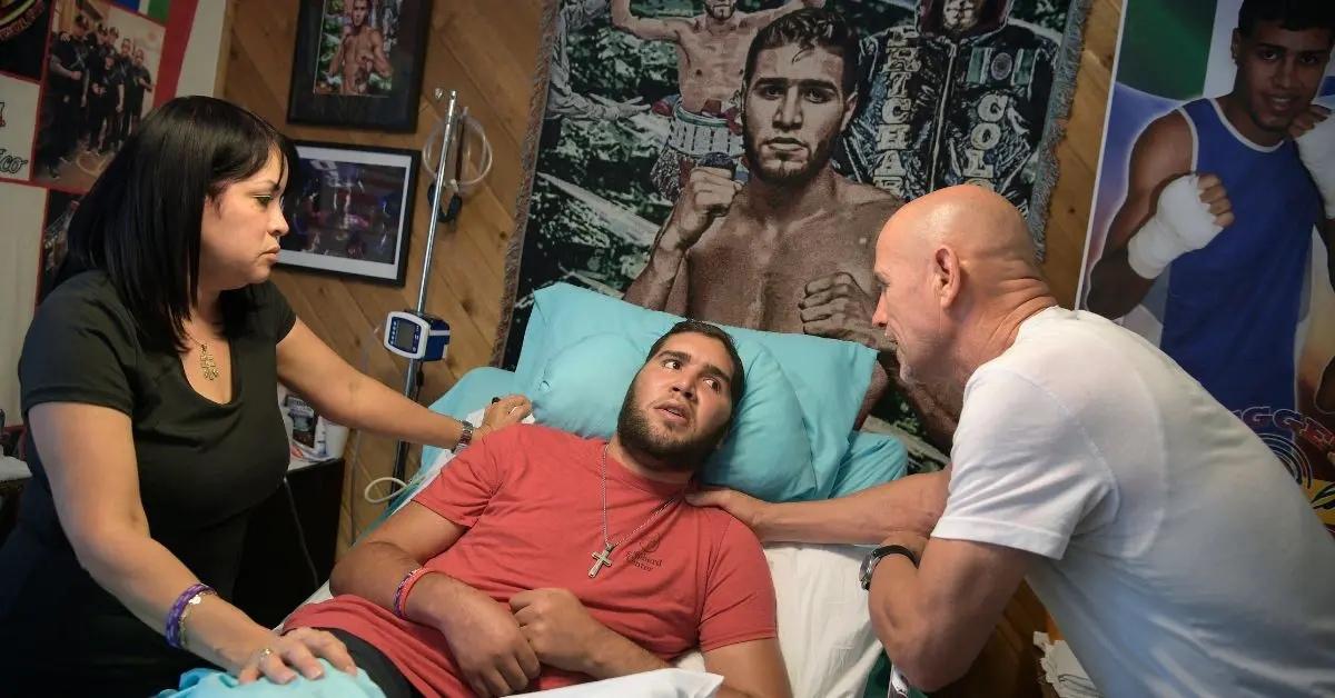 Prichard Colón after injury lying in a bed.