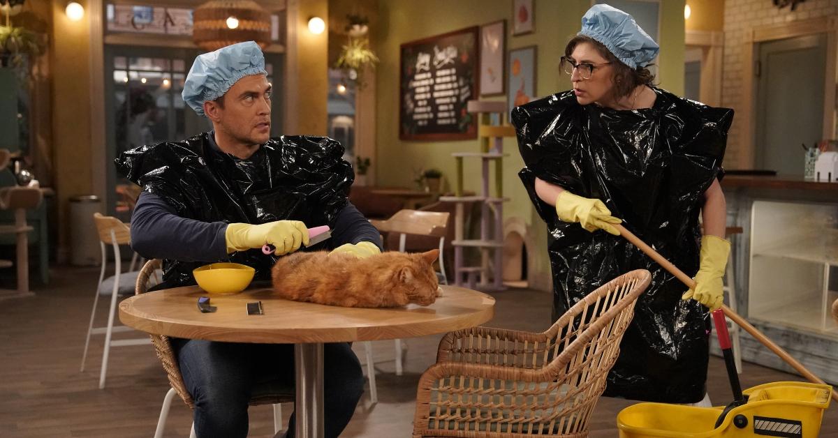 Kat (Mayim Bialik) and Max (Cheyenne Jackson) appear clean up a mess in episode, "Call Me Lady Avenger"