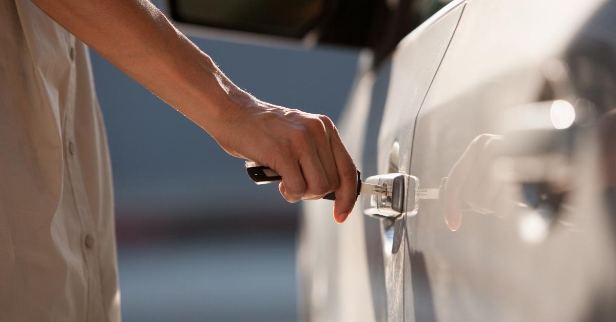 Person unlocking a car.