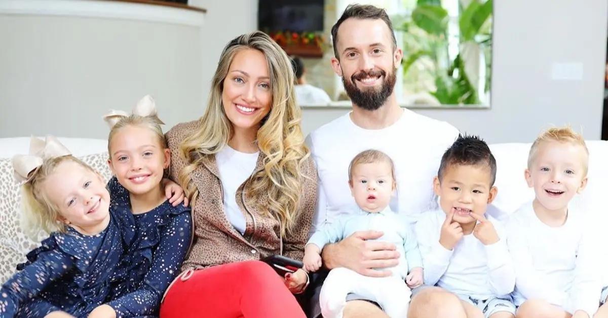 Myka Stauffer and her family gathered together on the couch.