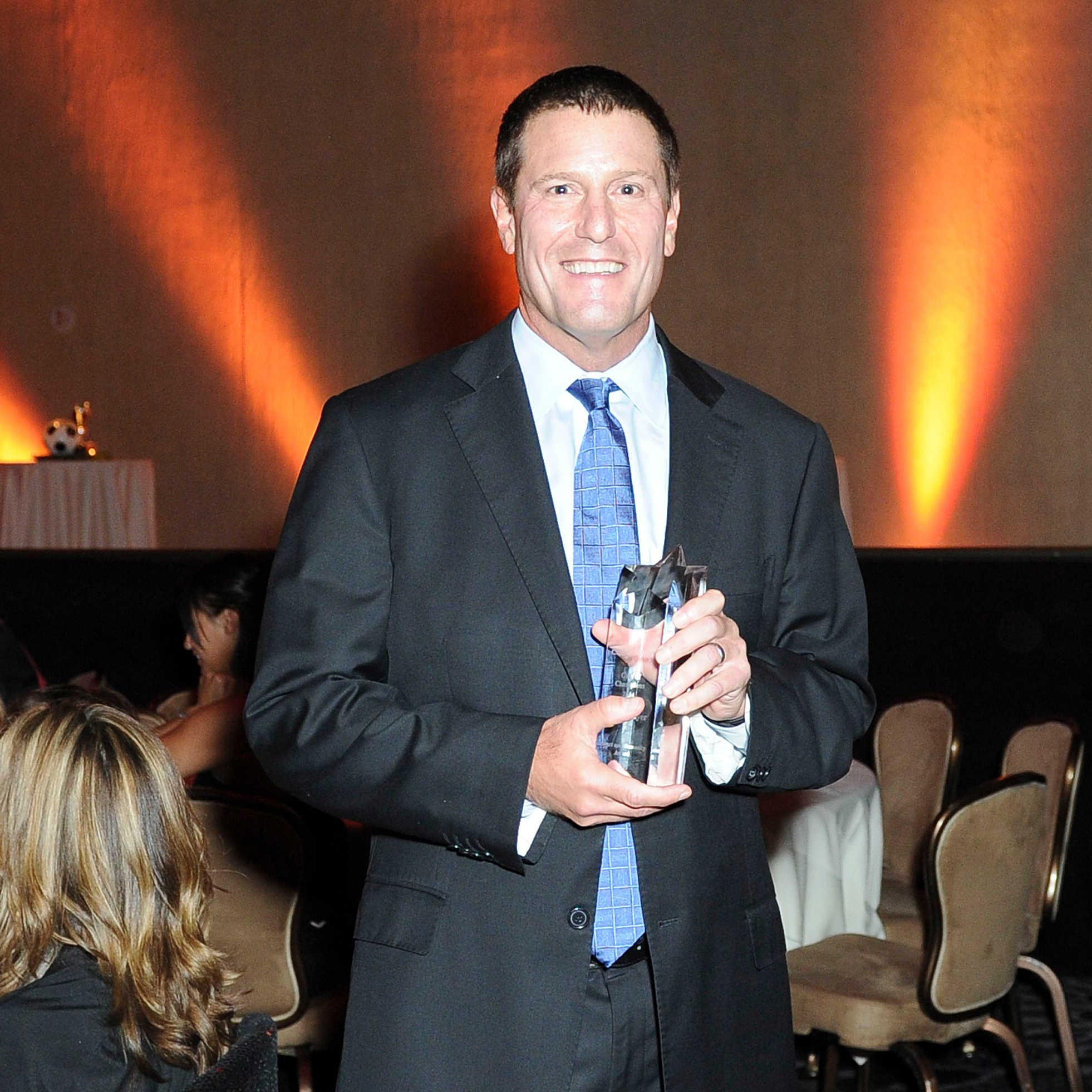 Walt Disney Company Executive Vice President Kevin Mayer is honored at the CoachArt Gala Of Champions at The Beverly Hilton Hotel on October 16, 2014 in Beverly Hills, California