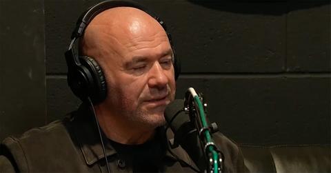 Dana White looking exasperated in front of a microphone.