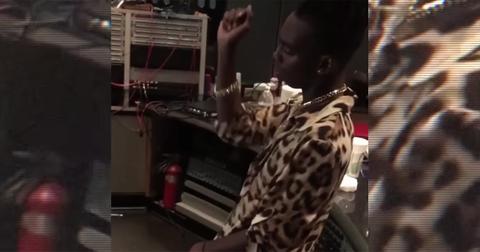 YNW Melly in a cheetah print shirt in a recording studio.