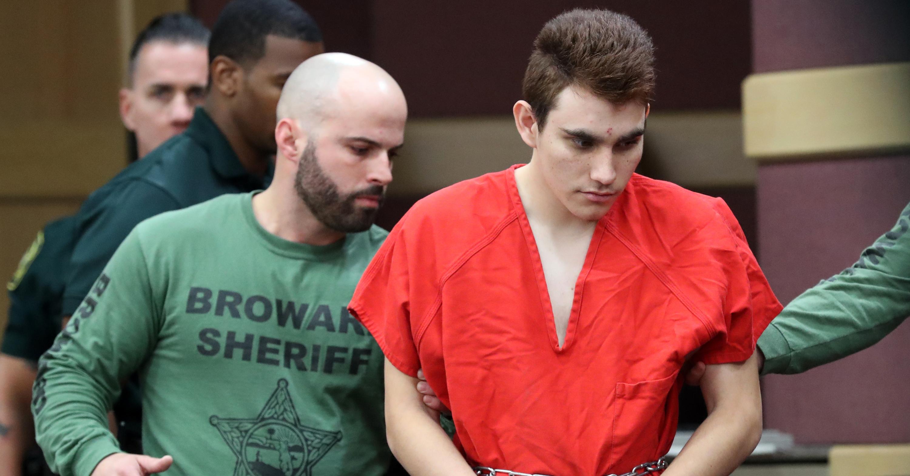 Nikolas Cruz is escorted by police