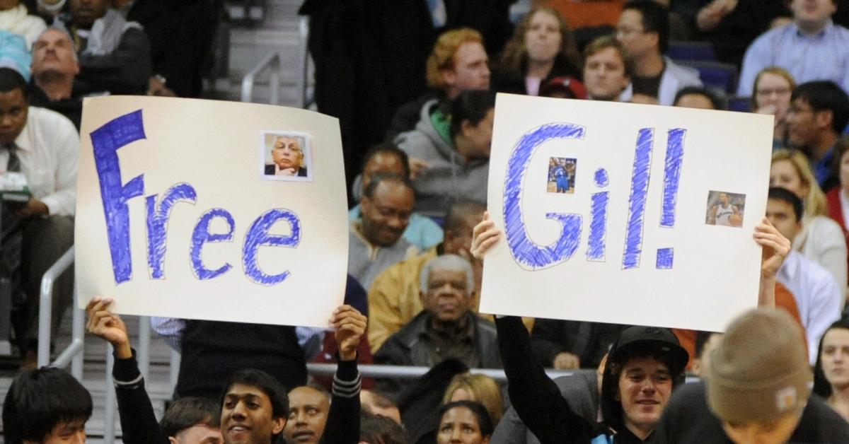 Fans holding up "Gree Gil" signs at a Washington Wizards game