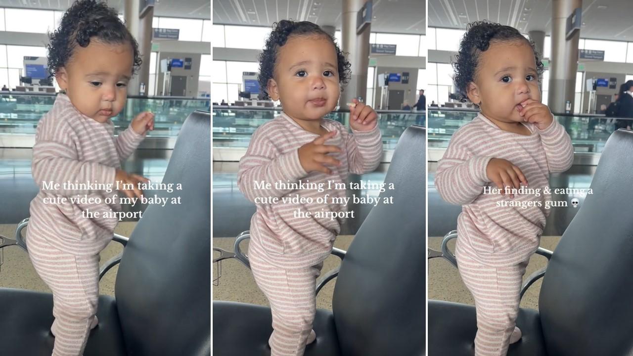 A baby girl finds a piece of gum at the airport and eats it