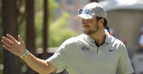 Josh Allen waving in a polo.