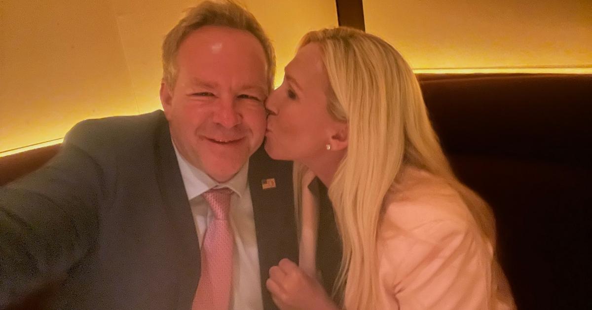 Brian Glenn and Marjorie Taylor Greene ion a selfie at a restaurant.