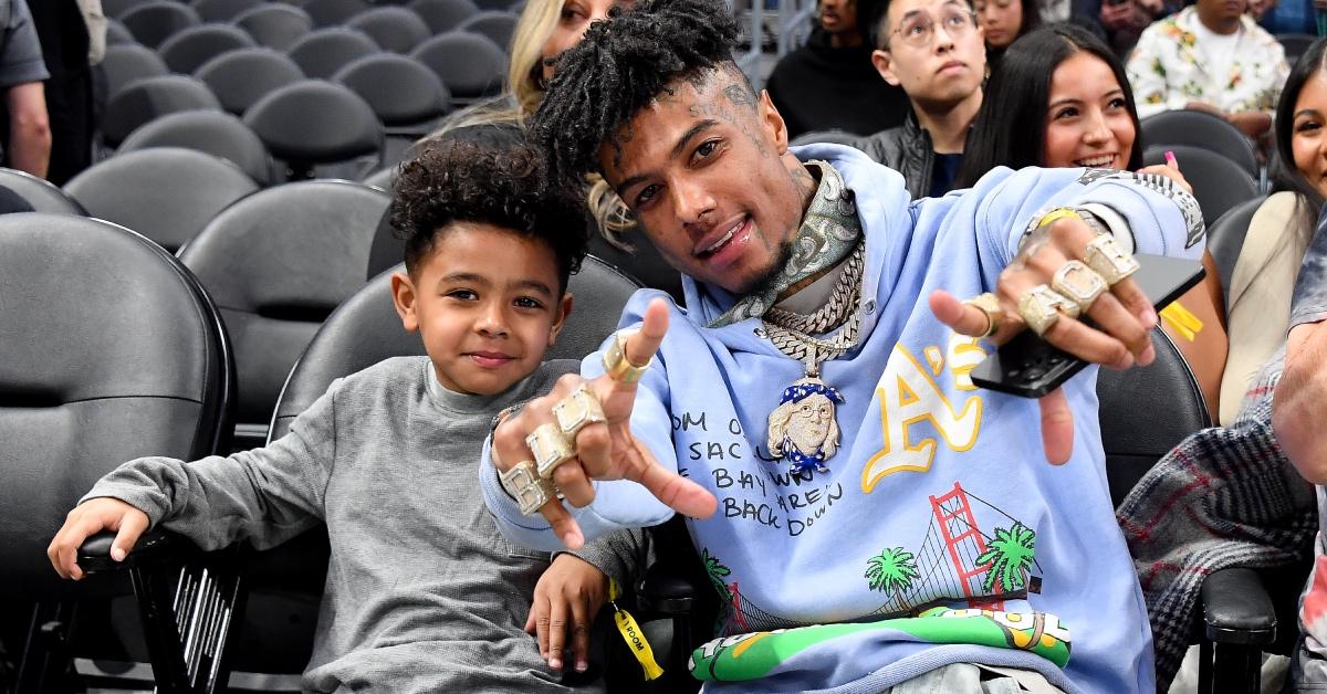 Rapper Blueface (R) and his son Javaughn J. Porter attend a basketball game.