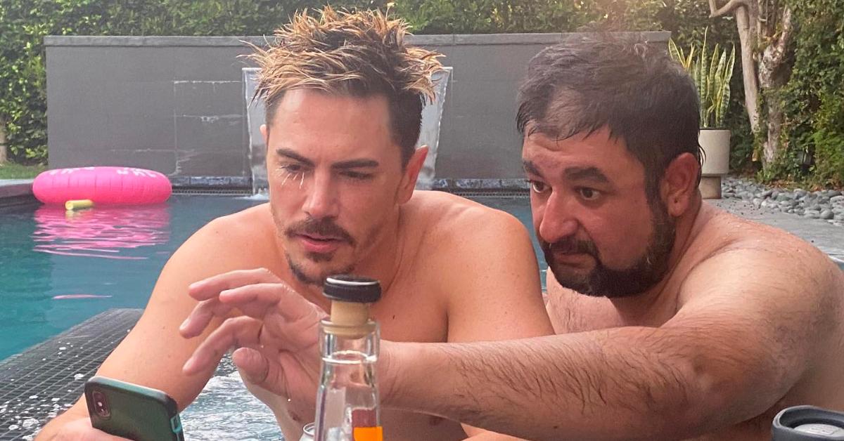 Tom Sandoval and his late friend, Ali Rafiq, looking at a phone.