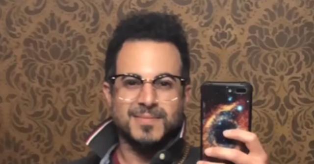 Spanish, real name Anthony Polichemi, taking a selfie