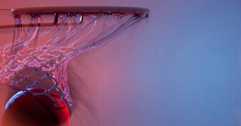 Basketball coming down the net after going in.