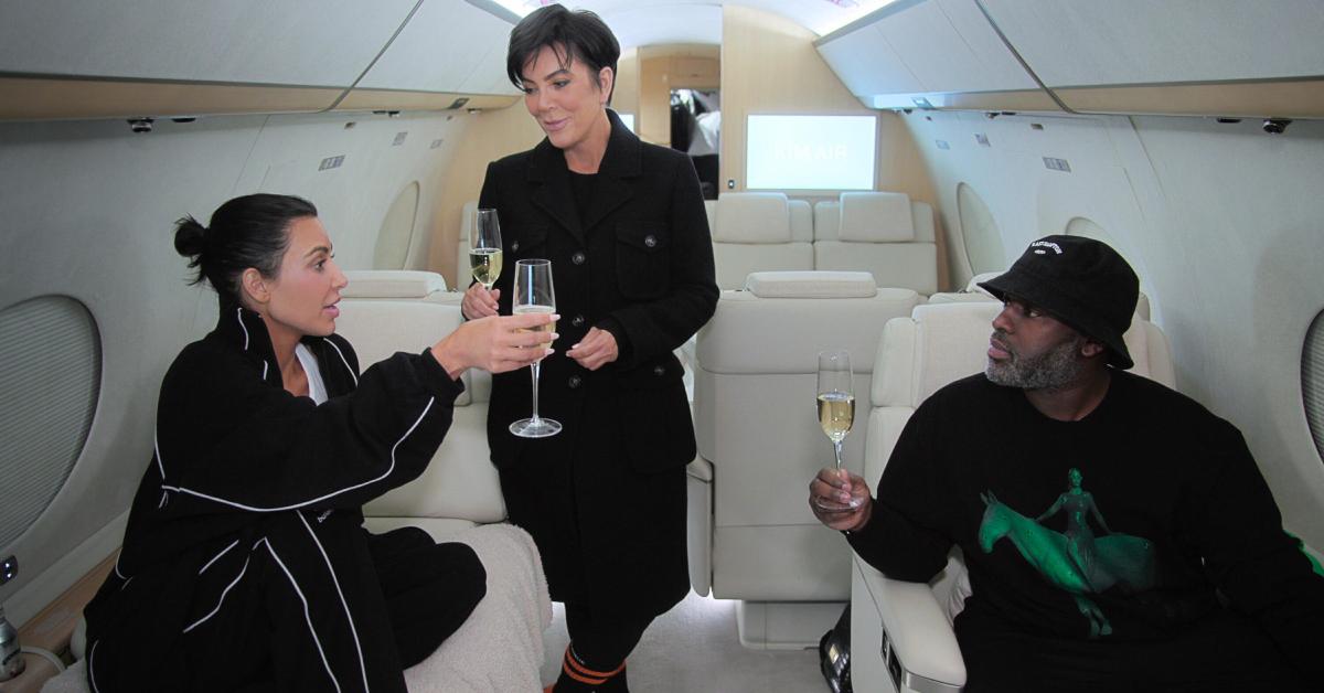 (L-R) Kim, Kris, and Corey drink champagne while on their way to Paris Fashion Week via Kim's private jet in the Season 5 premiere of 'The Kardashians.'