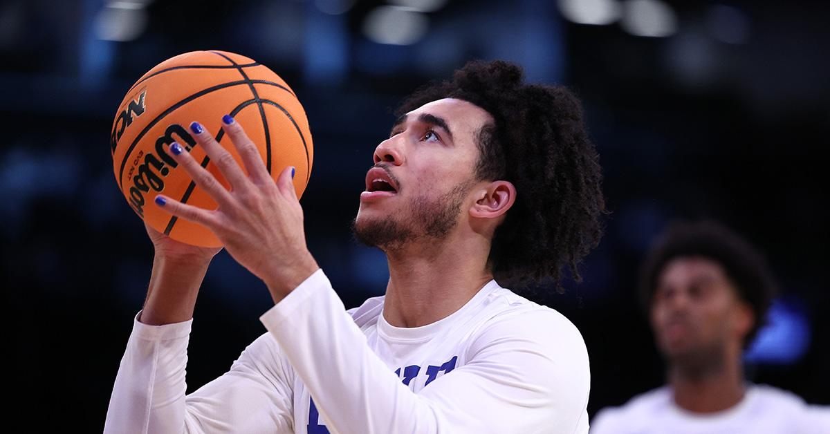 Jared McCain warming up before an NCAA game. 