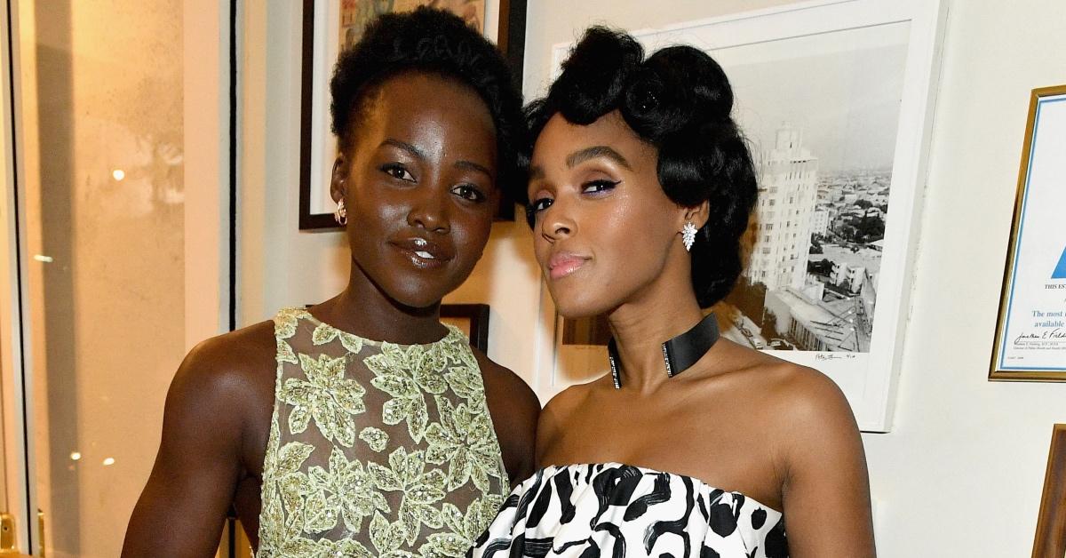 Lupita Nyong'o and Janelle Monáe attend an event in 2014. 