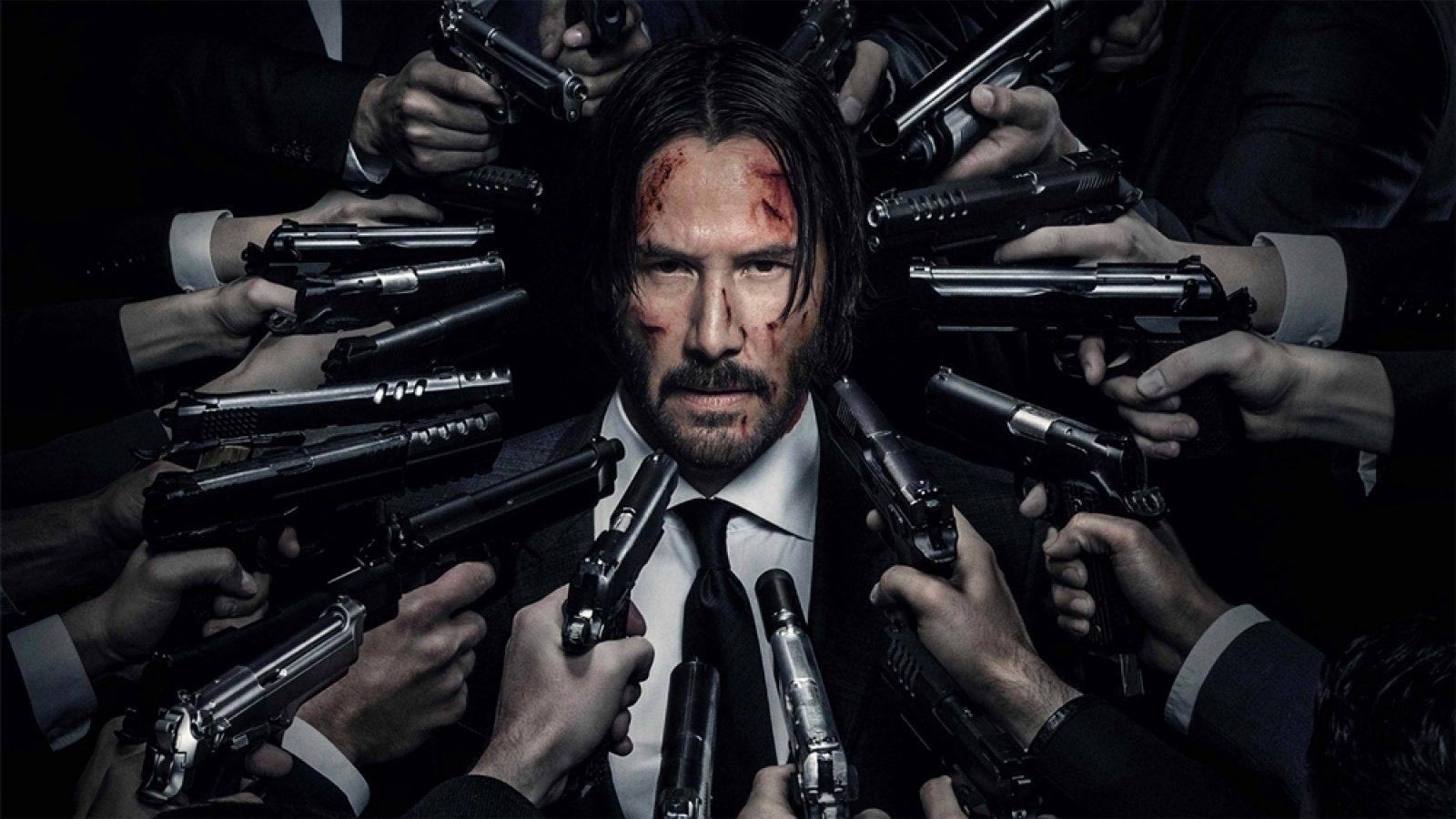 john wick guns on him