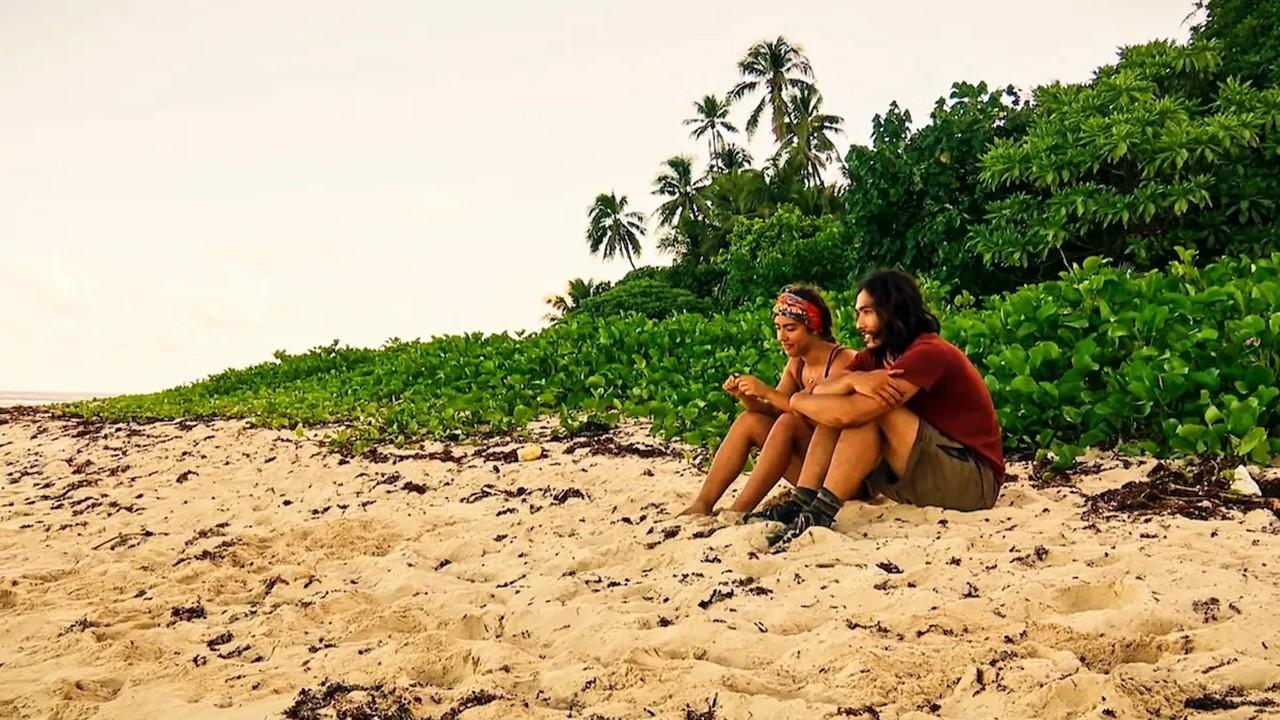 Dee and Austin sitting on a beach on 'Survivor'