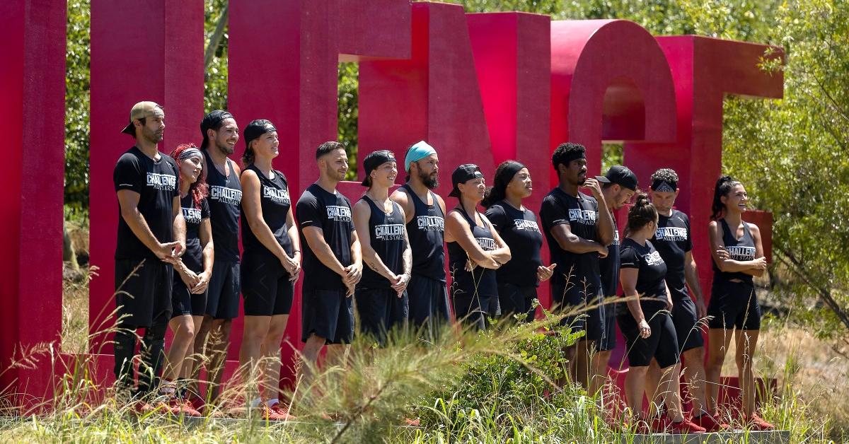 The Challenge: All-Stars 4 cast outside in front of a large sign that says The Challenge