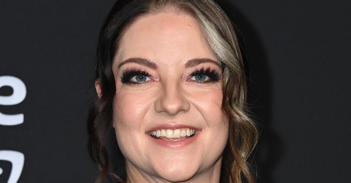 Ashley Mcbryde smiling in an upclose photo at the awards