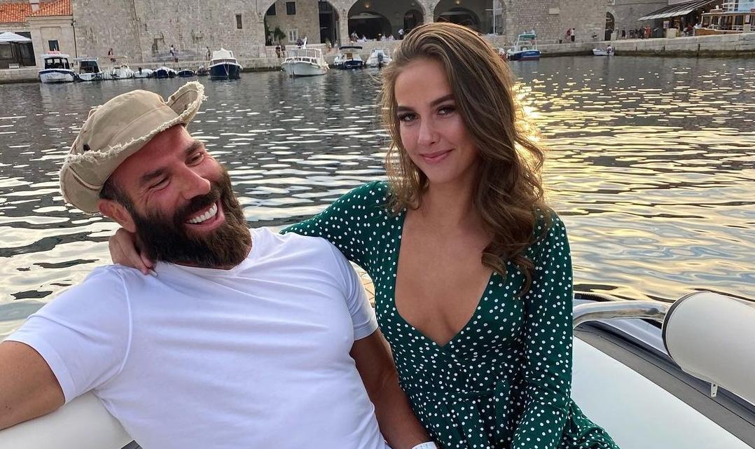 Dan Bilzerian on a boat with a woman