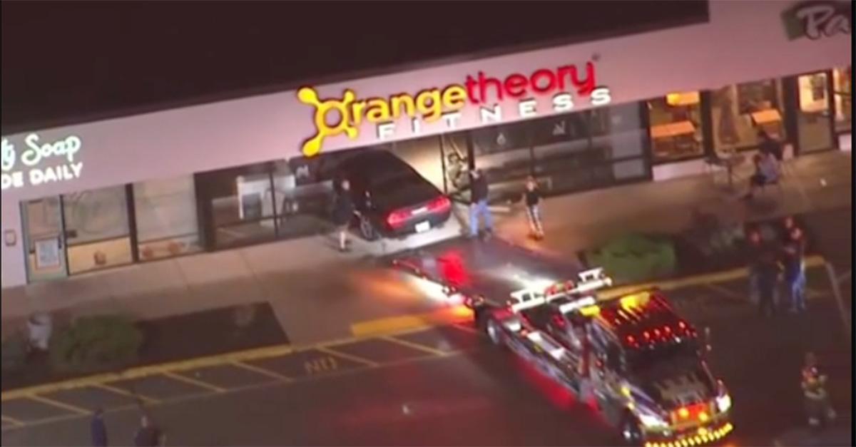 A car being pulled out of an Orange Theory Fitness in Boston 