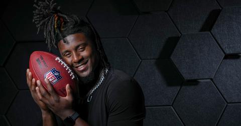 Kool-Aid McKinstry holding an NFL football