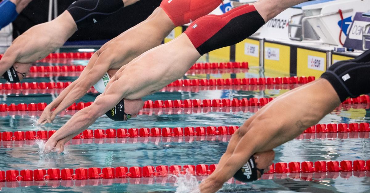 France's Maxime Grousset dives in men's 50m freestyle series during the French swimming championships.