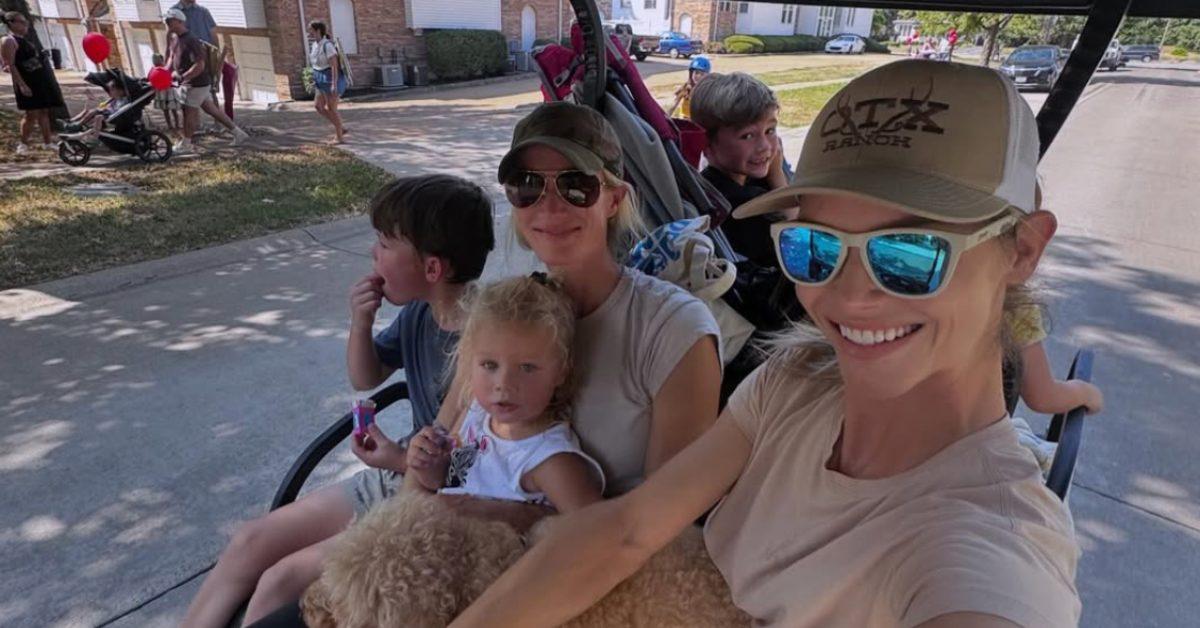 Meghan King and her kids on a golf cart.