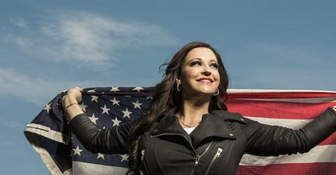 Natasha Owens holding an American flag
