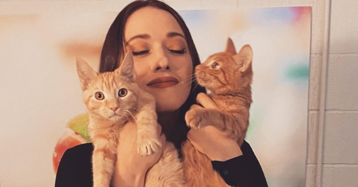 Kat Dennings with two orange cats