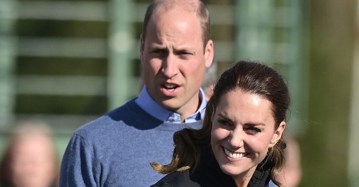 (l-r): Prince William and Kate Middleton playing outside.