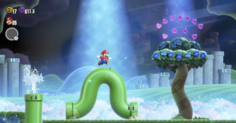 'Super Mario Bros. Wonder' Mario running over a worm-like green pipe.