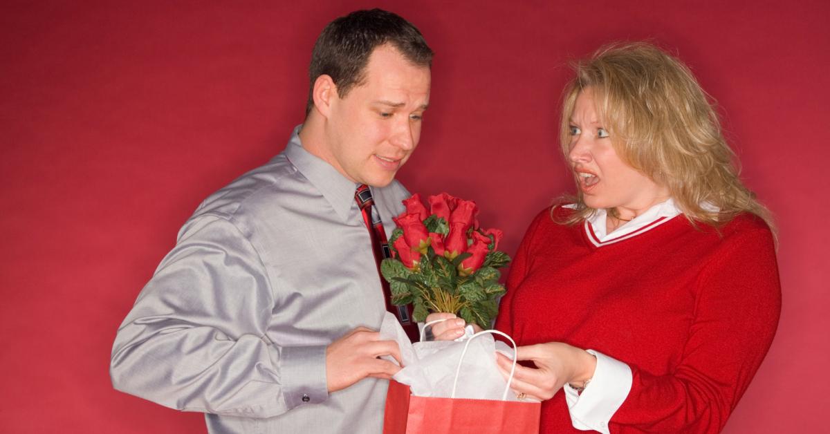 A couple exchanging gifts, and the woman hates her gift.