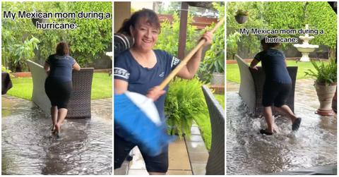 Mexican mom holds broom and pushes couch into backyard during a hurricane.