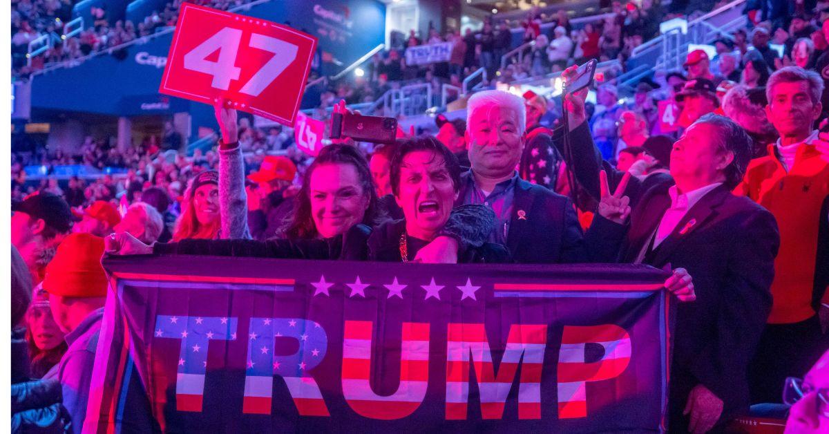 Trump supporters holding signs at a Washington, D.C. rally. 