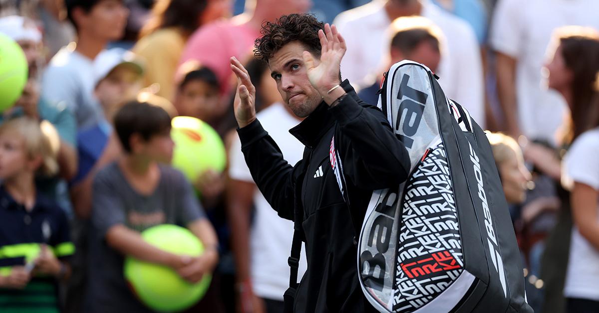 Dominic thiem waving to audience at tennis match