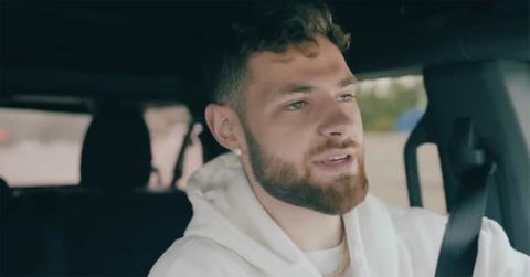 Hunter Dickinson driving in his car.