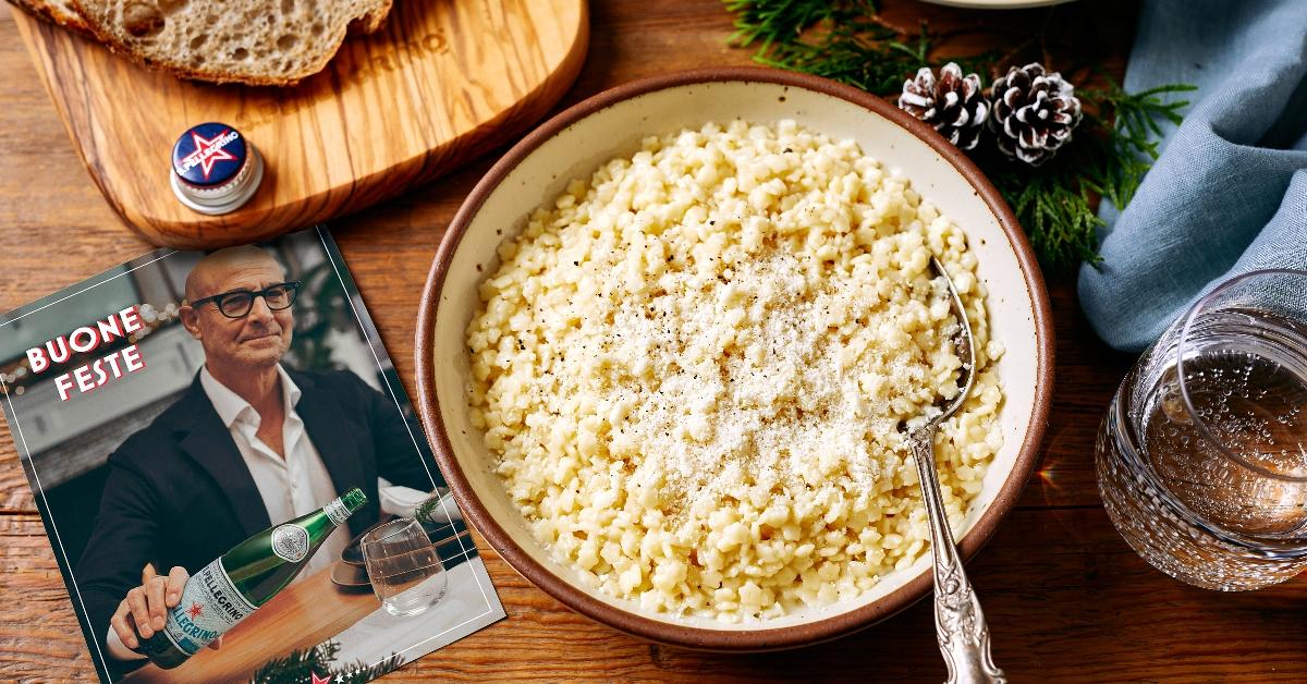 Table with bowl of pastina with butter and cheese as part of actor and filmmaker Stanley Tucci's S.Pellegrino 2023 recipe kit 