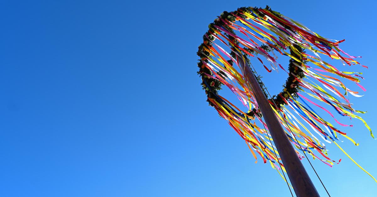 A maypole against a blue sky