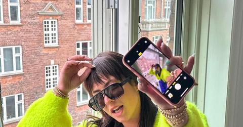 Close up shot of Victoria in a neon green sweater