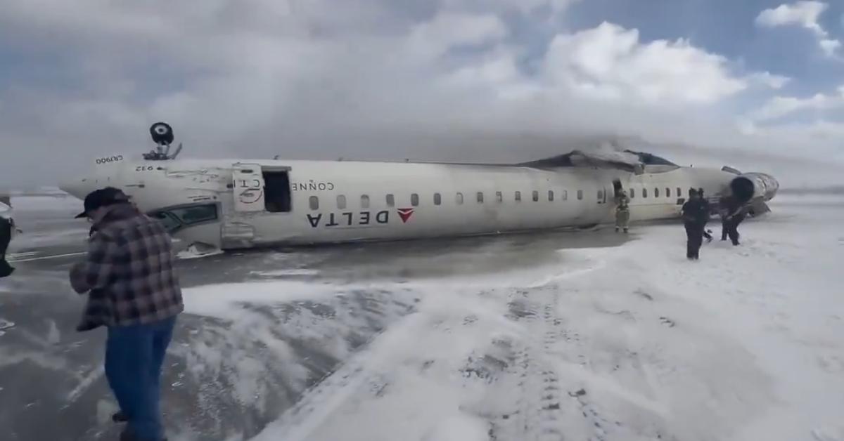 A photo of the Delta flight flipped upside down on the runway.