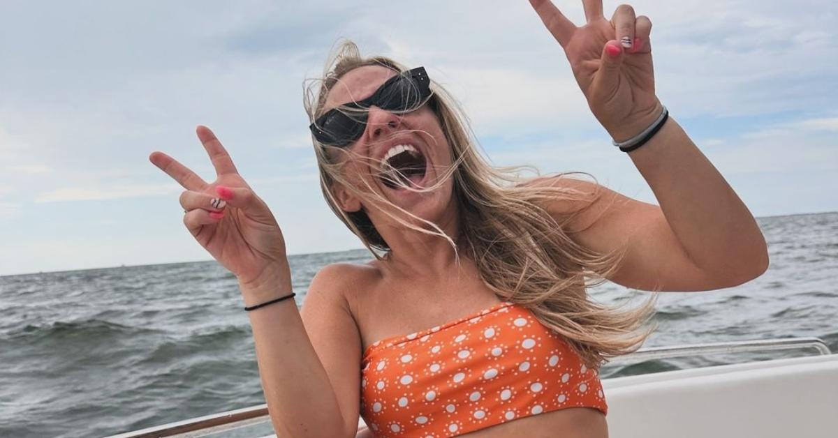 Mackenzie McKee on a boat in an orange bikini