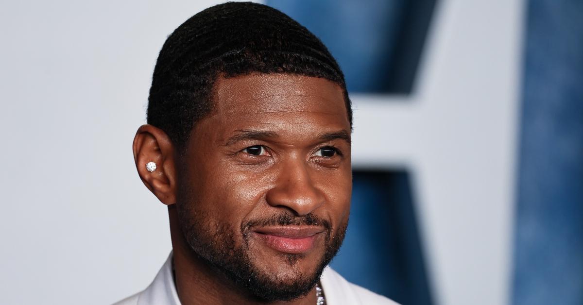 Usher Raymond wears diamond earring on the Vanity Fair red carpet.