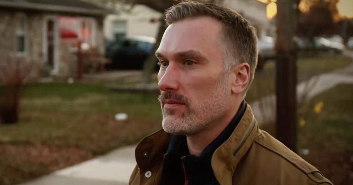 David Hibbs stands on the street where he grew up.