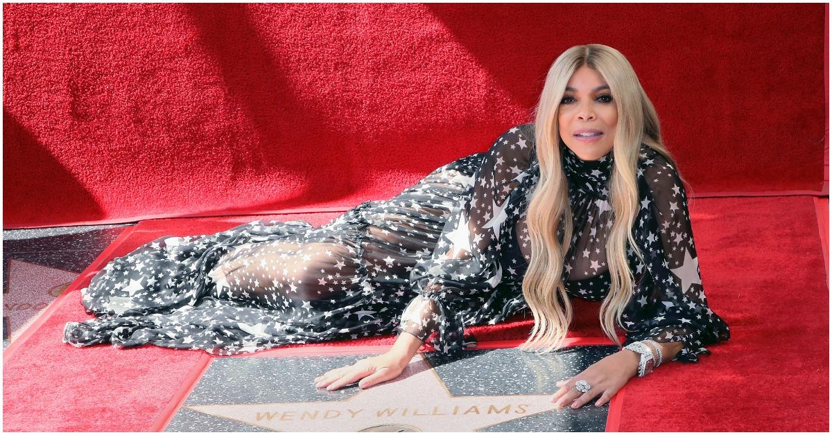 Wendy Williams resting next to her star on the Hollywood Walk of Fame.