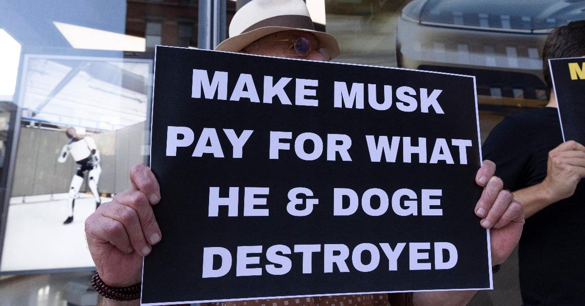 DOGE protest sign